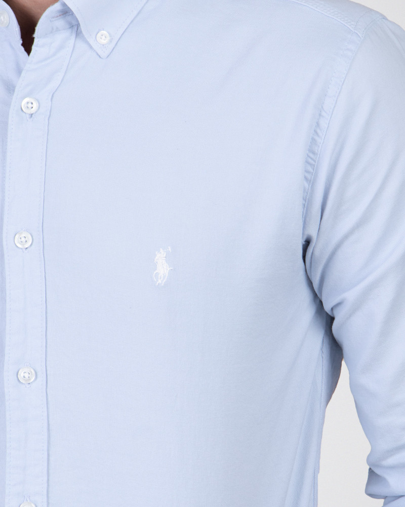 پیراهن آستین بلند ساده آبی روشن دارای لوگو روی سینه 18221170